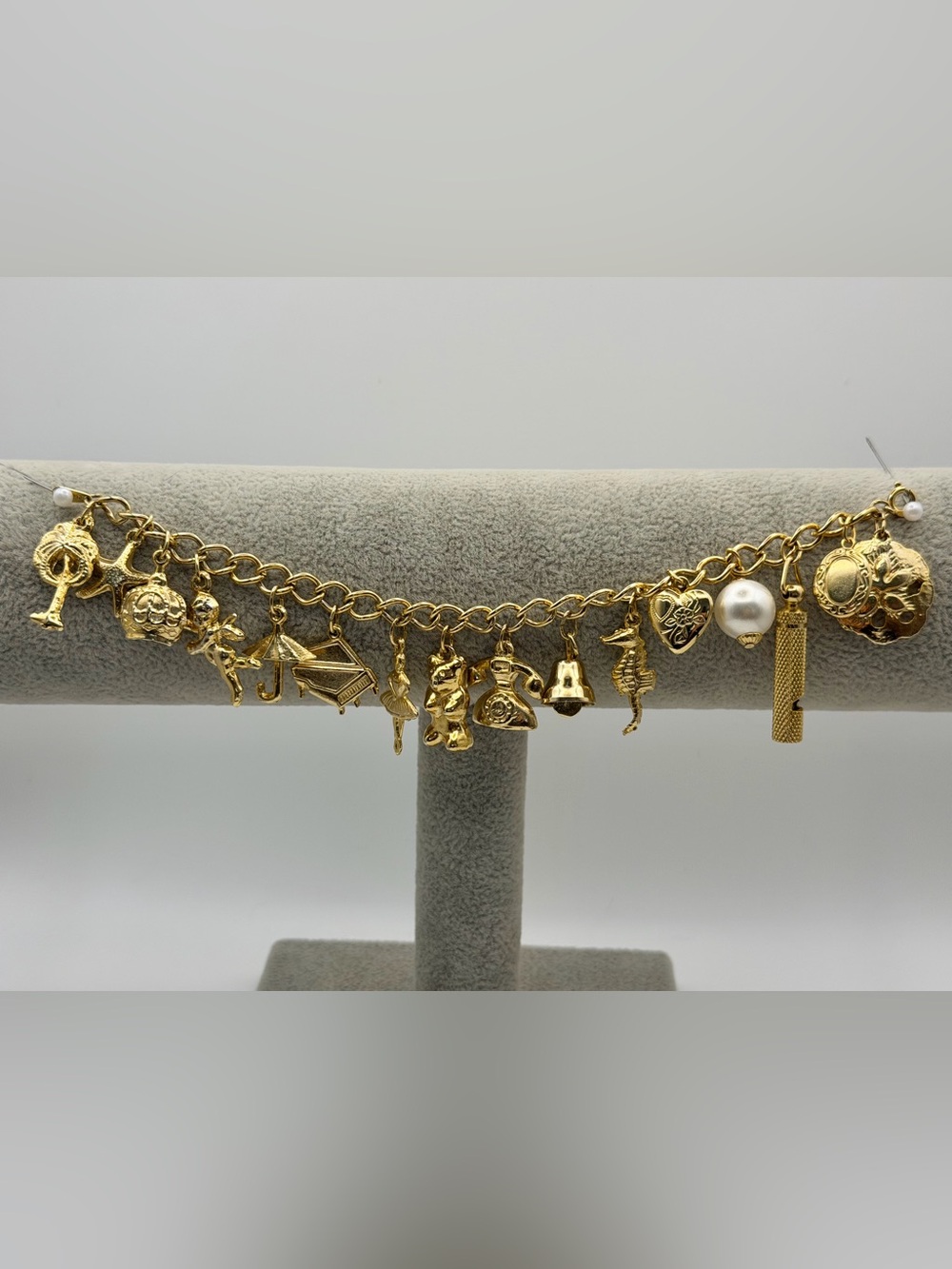 Vintage (ca. 1990) 23k gold plated charm bracelet - 7” length, unsigned